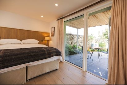 A super king size bedroom at Map Maker's Cottage, Roundstone, Galway