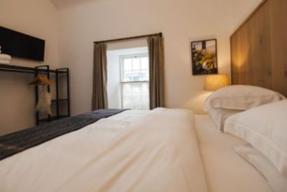 Super king size bedroom at Weaver's Cottage, Roundstone, Galway