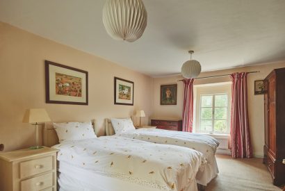 A twin bedroom at Withington Grange, Cotswolds 