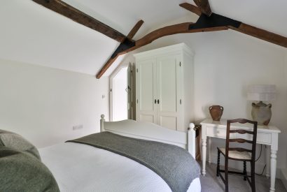 The dressing table and wardrobe in the master bedroom at Rambling Rose Cottage, Cotswolds