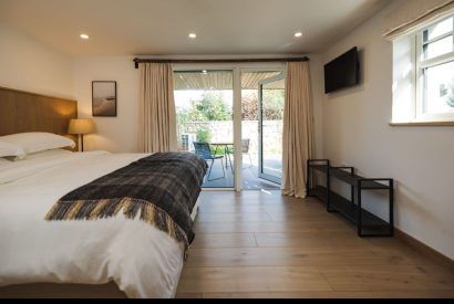 A super king size bedroom at Map Maker's Cottage, Roundstone, Galway