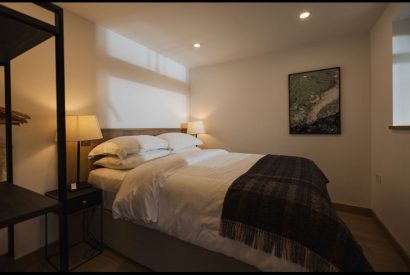 Queen size bedroom bedroom at Map Maker's Cottage, Roundstone, Galway