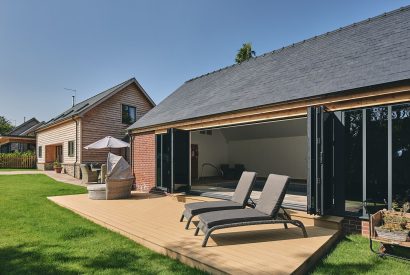 The swimming pool and sun loungers at The Byre, Welsh Borders