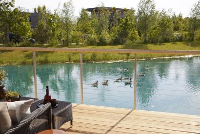 The balcony with lake view at Lakeside Cabin, Cotswolds