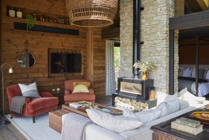 The living room with log burner at Lakeside Cabin, Cotswolds