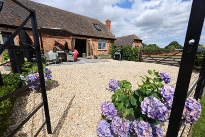 The gate leading to the patio area at Piglet's Hideaway, Cotswolds