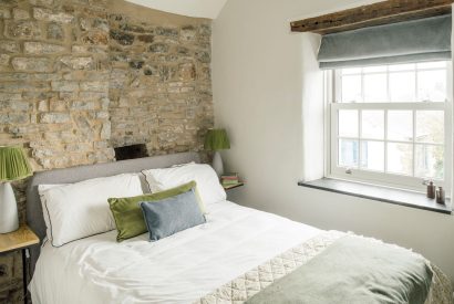 A king size bedroom at Sweet Pea Cottage, Litton, Peak District