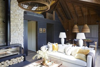 The living room with log burner at Lakeside Cabin, Cotswolds