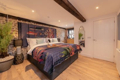 A super king size bedroom at The Pool house, Chapmanslade, Wiltshire