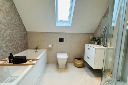 A bathroom at Honey Stone Cottage, Cotswolds