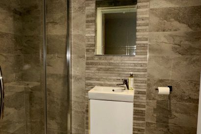 A shower room at Honey Stone Cottage, Cotswolds