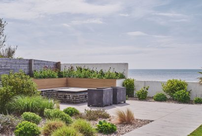 The garden and hot tub at Beach Manor, West Sussex