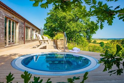 The hot tub overlooking the countryside at Harberton Cottage, Devon