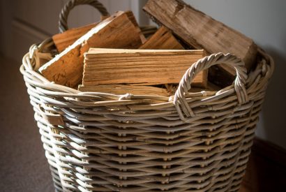 A log basket at Hawthorn Farmhouse, Somerset