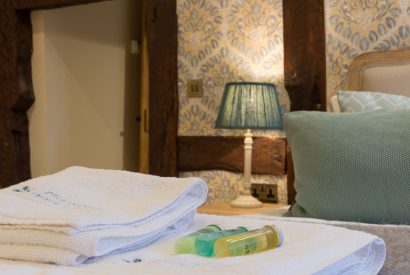 A super king sized bedroom at The Thatched Cottage, Somerset