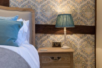 A super king sized bedroom at The Thatched Cottage, Somerset