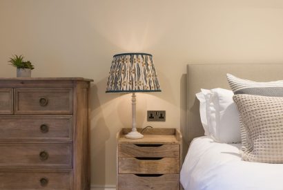 A super king sized bedroom at The Thatched Cottage, Somerset