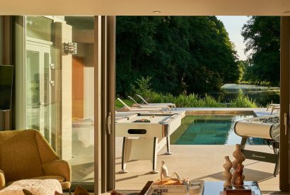 View of the heated outdoor swimming pool at Edgewater House, Hampshire