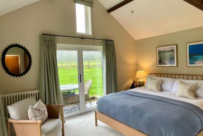 A super-king sized bedroom at Wheatsheaf Barn, Hampshire