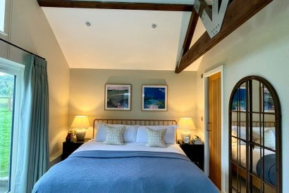 A super-king sized bedroom at Wheatsheaf Barn, Hampshire