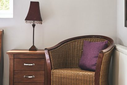 A chair in the bedroom at Harcombe Cottage, Devon