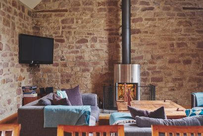 The living room with log burner at Woodpecker Loft, Peak District
