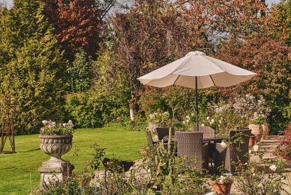 An outdoor dining area at Roupel Hall, Devon