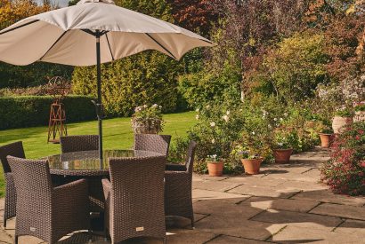 An outdoor dining table at Roupel Hall, Devon