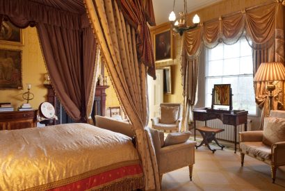 A four poster bedroom at Broughton Hall, Yorkshire Dales