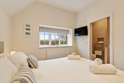 A king size bedroom at Oxwich Retreat, Gower
