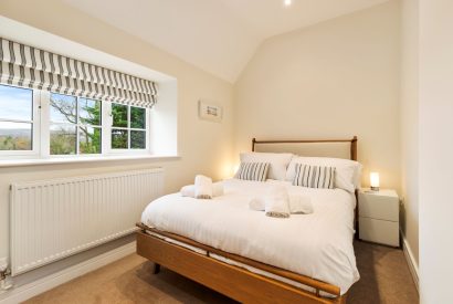 A king size bedroom at Oxwich Retreat, Gower