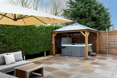 The covered hot tub at Oxwich Retreat, Gower