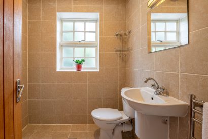 The WC with a walk in shower beside the utility room at Tinkers Folly, Yorkshire
