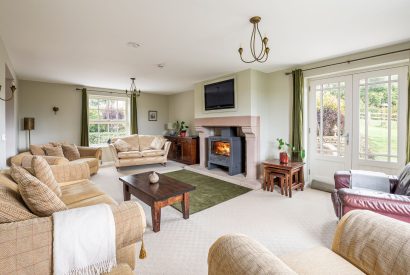 The living room with a log-burning stove at Tinkers Folly, Yorkshire