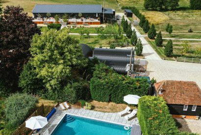 The heated outdoor swimming pool at Lovage Pyggy, Hampshire