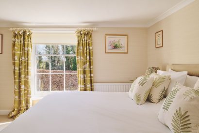 A super king sized bedroom at Hockham House, Norfolk Coast