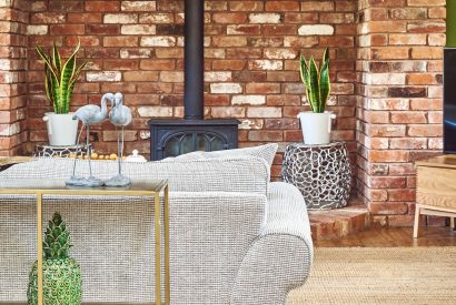 The living room with fireplace at The Luxury Barn, Peak District