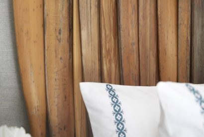 A headboard made of oar's at The Beach House, Devon