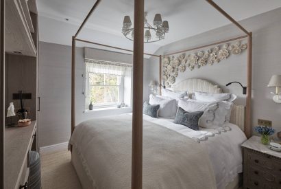 A bedroom with four poster bed at Beatrix Cottage, Lake District