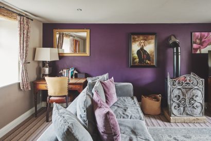 The living room with log burner at Green Pastures Cottage, Peak District