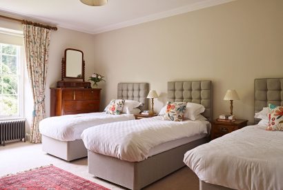 A triple bedroom at Georgian House, Devon