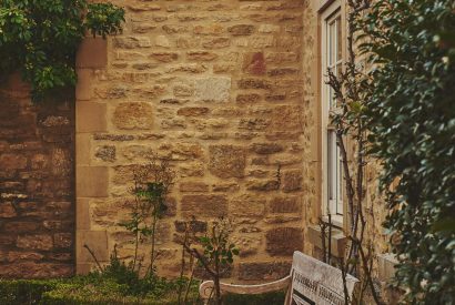 A bench in the garden at Tennyson House, Cotswolds