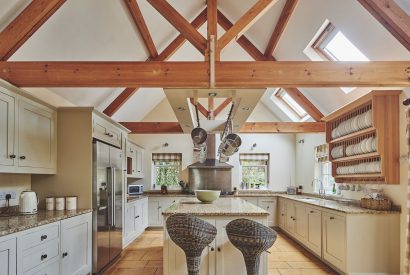 The kitchen with oak beams at Tennyson House, Cotswolds