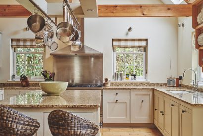 The kitchen with breakfast bar at Tennyson House, Cotswolds