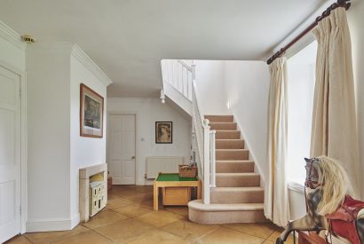 The hallway and stairs at Tennyson House, Cotswolds