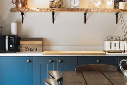 The kitchen and dining table at Holwell Farmhouse, Devon