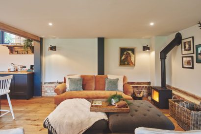 The living room with log burner at The Barnstay, Hampshire