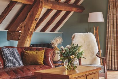 A vase of flowers in the living room at Hay Bale Cottage, Worcestershire