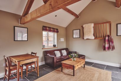 The living room and dining table and chairs at Stable Cottage, Worcestershire