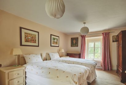 A twin bedroom at Withington Grange, Cotswolds